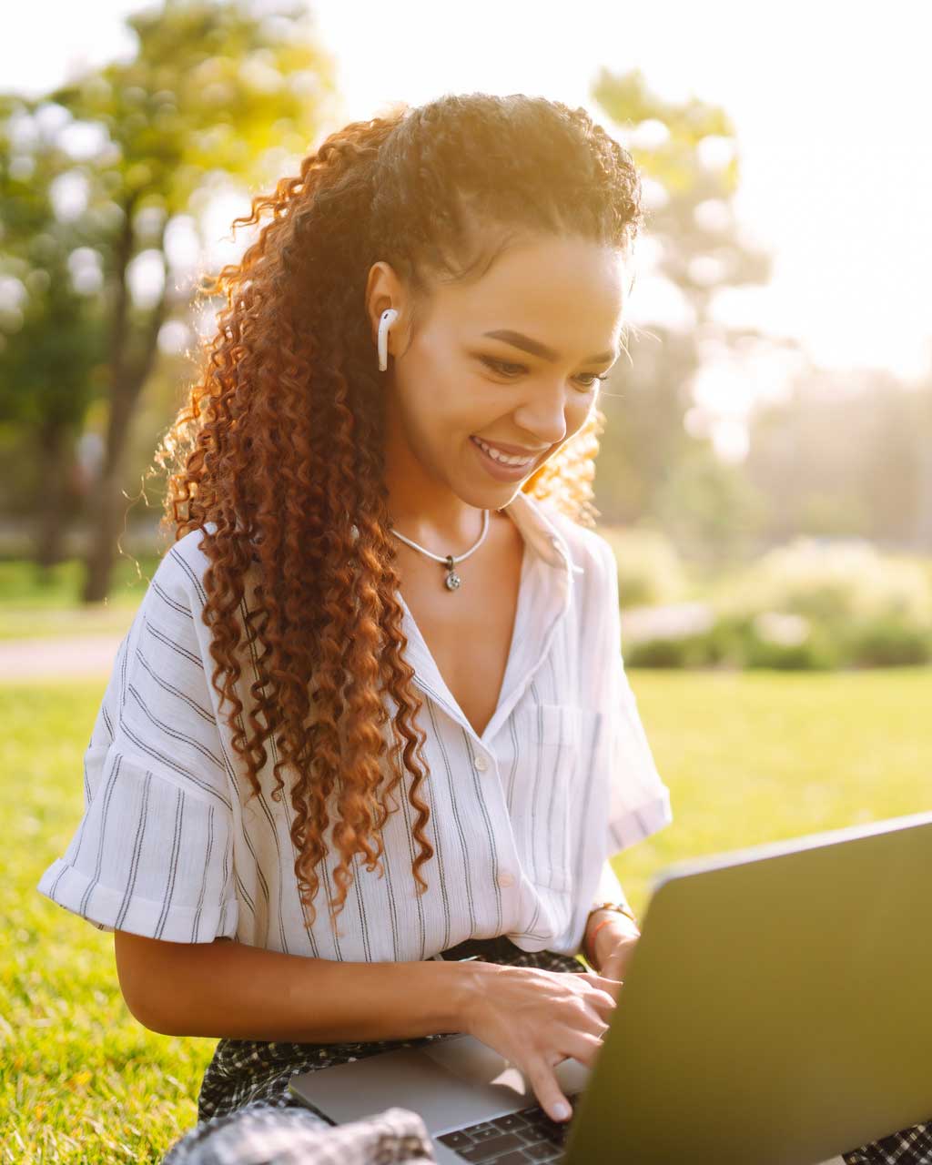 high-school-student-laptop-outdoors-portrait